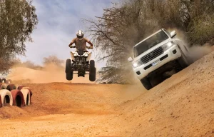 kish-entertainment A-Man-Riding-Motorebike-And-A-Car- In-Kish-Safari-